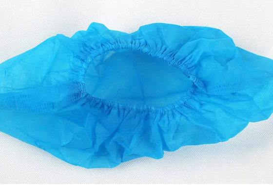 La scarpa blu non tessuta riguarda l'anti scivolo eliminabile Eco morbido amichevole